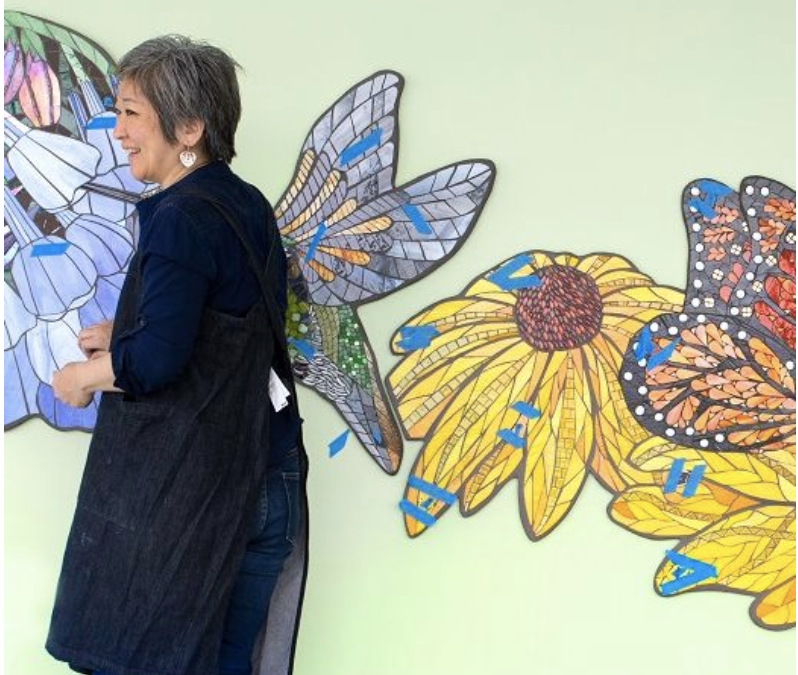 Artist Aya Kinoshita of Lancaster puts the finishing touches on her stained glass and ceramic tile artwork at Penn State Health Hampden Medical Center.