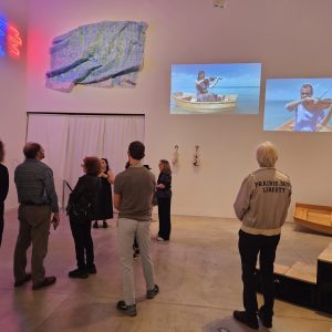 NOAHCON 24 Attendees viewing art in a gallery.